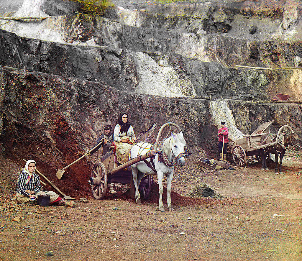 A family, with shovels and horse-drawn carts, working at the iron mines in the Bakaly hills, 1910. By Sergei Prokudin-Gorsky, Library of Congress.