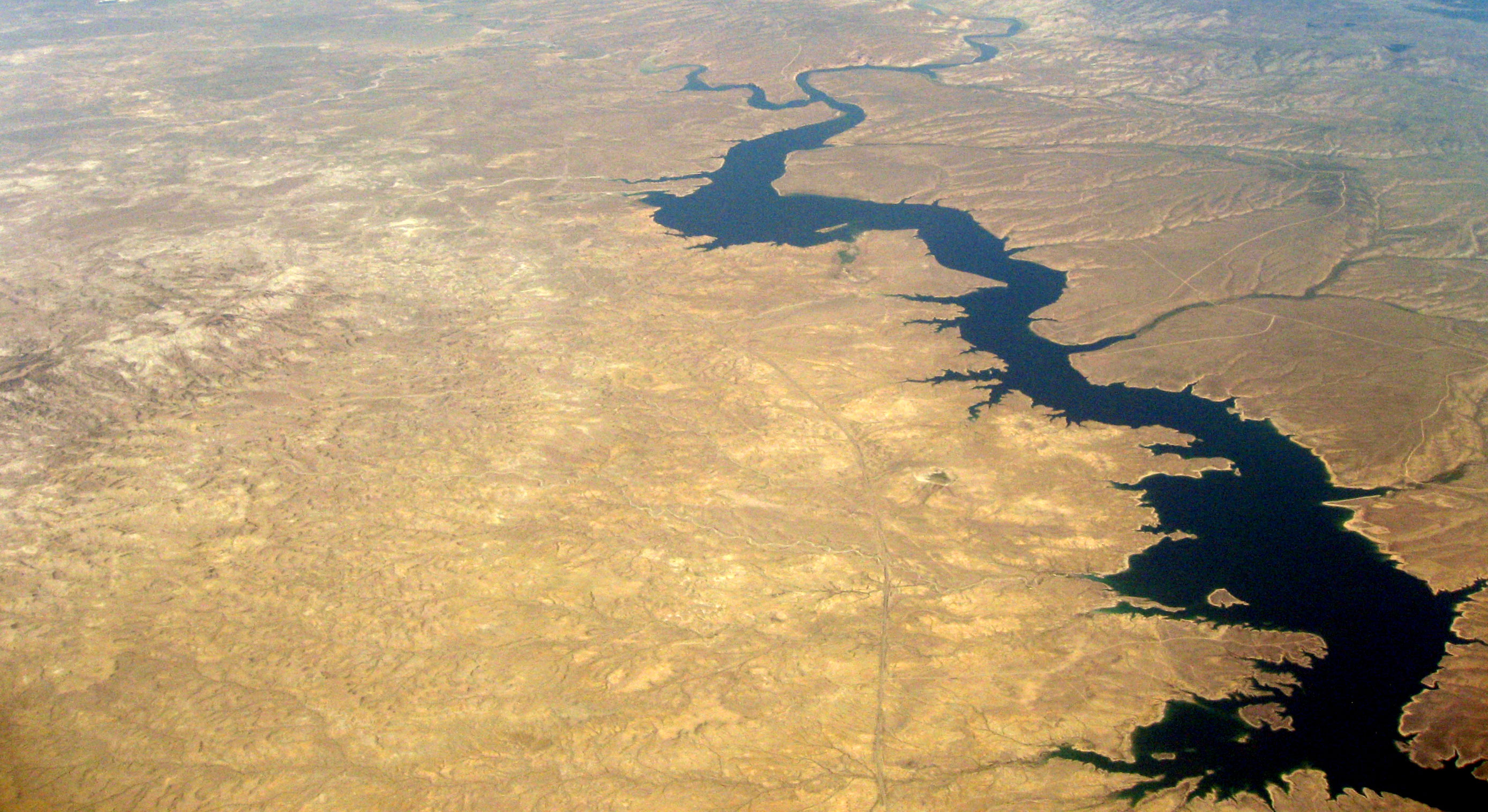 An aerial view looking north-northeast toward Rock Springs, WY of the Flaming Gorge Reservoir and Green River in Sweetwater County. Blacks Fork, a Green River tributary, extends off to the northwest. Wyoming Highway 530 runs up the center of the image along the west side of the reservoir. The northern end of Black Mountain in the Devil's Playground WSA is visible on the left side of the image. The bottom of the image is approximately 3 miles north of the Wyoming-Utah border. Wikimedia Commons. An aerial view looking north-northeast toward Rock Springs, WY of the Flaming Gorge Reservoir and Green River in Sweetwater County. Blacks Fork, a Green River tributary, extends off to the northwest. Wyoming Highway 530 runs up the center of the image along the west side of the reservoir. The northern end of Black Mountain in the Devil's Playground WSA is visible on the left side of the image. The bottom of the image is approximately 3 miles north of the Wyoming-Utah border. Wikimedia Commons.