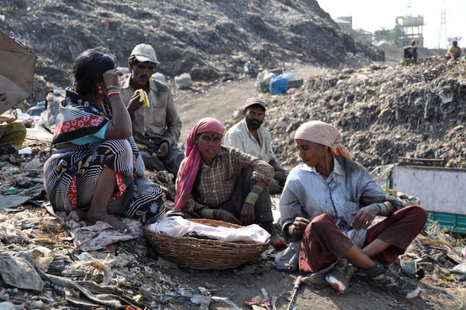KKPKP waste pickers taking a brief lunch break at the Uruli landfill, KKPKP.