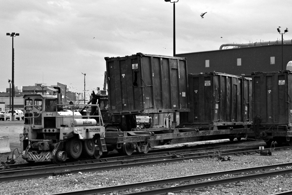 At IWS's Doremus Avenue terminal in Newark, a forklift deposits a loaded trash container on a flatcar. In a few days, its contents will be in Ohio. 02/2018 