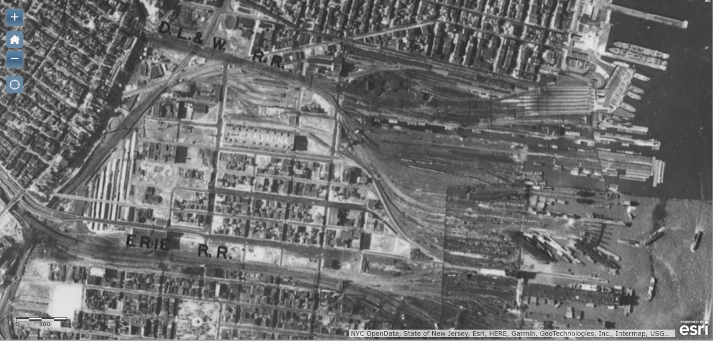 Hoboken yards, 1930. The edge of Bergen Hill is visible in the line running diagonally down the left side of the image; the other described constraints should be plainly evident. The Lackawanna's coal pier is the one immediately to the north of the pier with the diagonal slips on its southern face.https://www.arcgis.com/apps/OnePane/basicviewer/index.html?appid=0d55ac76c7264242b7b97ac6d2847b6e
