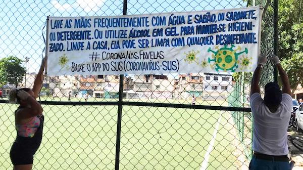 Campaign banner on how to prevent spread of COVID-19, Complexo da Maré (Rio de Janeiro), 2020. United Nations  
(Source: https://www.un.org/en/coronavirus/brazil%E2%80%99s-favelas-organize-fight-covid-19)
