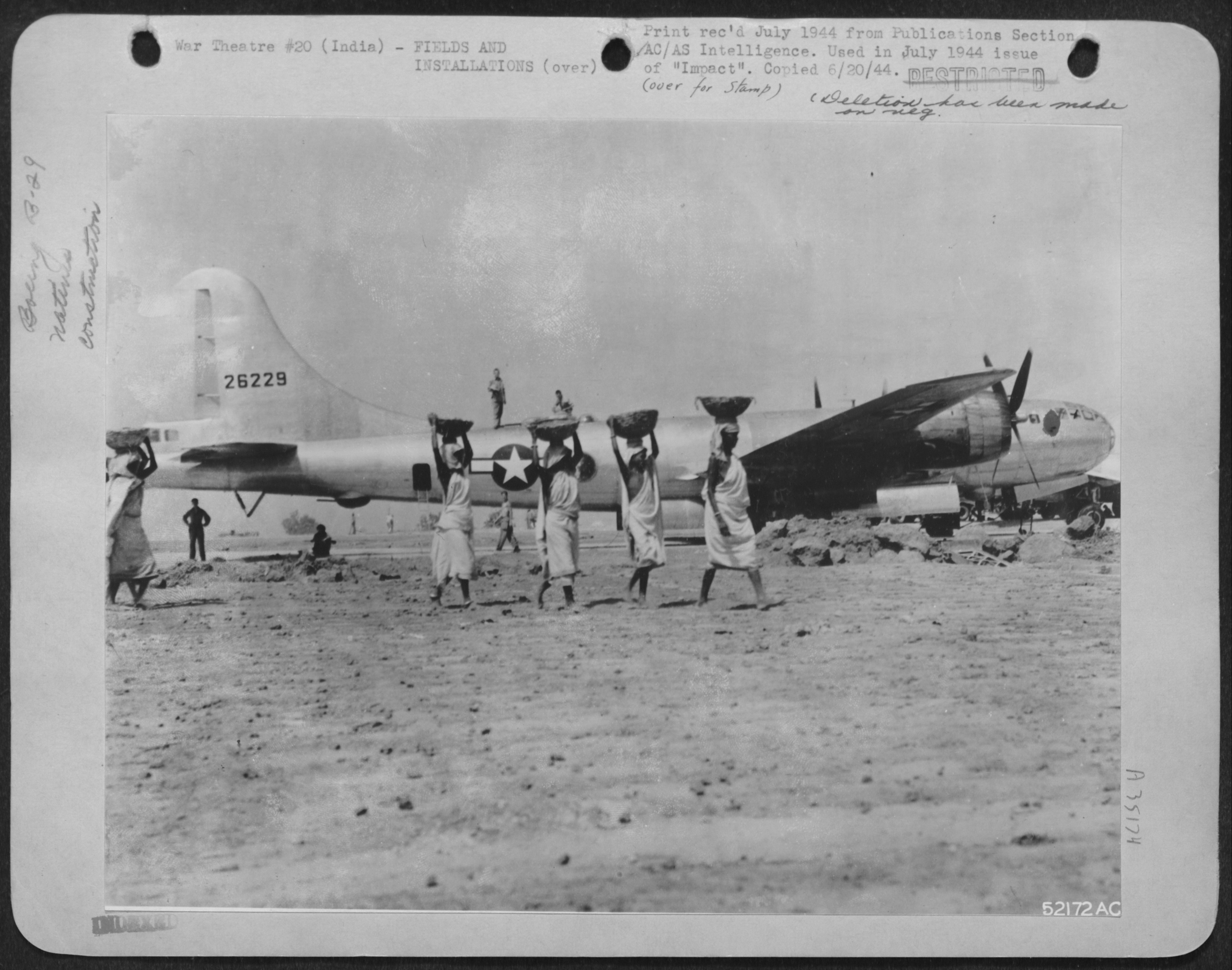 Juxtaposition in a Publications Section photograph of airbase construction, July 1944. 'Women of India cart away dirt and stones in baskets balanced on their heads during the construction of base in India. Hundreds of such women worked alongside the men. Construction was far from completed when the first Boeing B-29 landed.' NARA, Record Group 342, 342-FH-3A35174-52172AC.