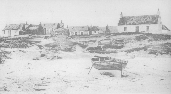 Black and white postcard of Port an Tobair, Balemartine, with three fishing dinghies in the foreground, probably photographed in the early 20th century.  An Iodhlann